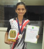 Krishna with a trophy, medal and certificate